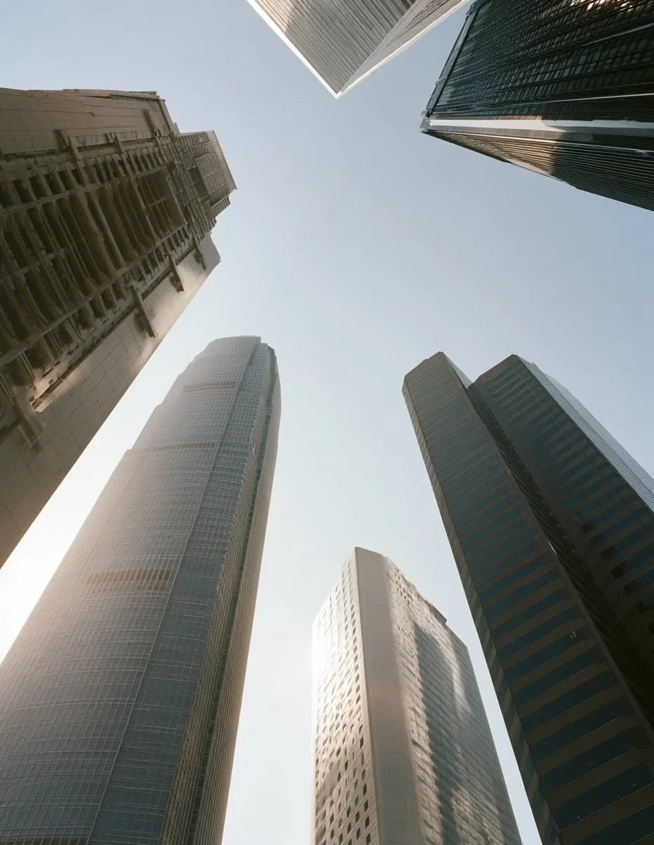 Looking up at the IFC and Central towers, Hong Kong, in morning light