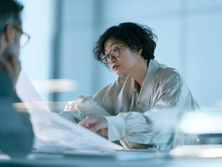 A senior HR or finance leader reviewing figures